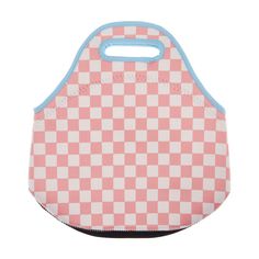 a pink and white checkered bag with blue handles