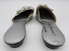 Gorgeous vintage womens flats Metallic silver pointed toe slip on shoes with beautiful big silver bows women's size 7 Silver Slip-on Flats With Round Toe, Silver Slip-on Party Mules, Silver Slip-on Mules For Party, Silver Slip-on Closed Toe Flats, Silver Slip-on Flats With Flat Heel, Silver Slip-on Flats, Silver Slip-on Flats For Spring, Silver Flat Mules For Spring, Spring Silver Flat Mules