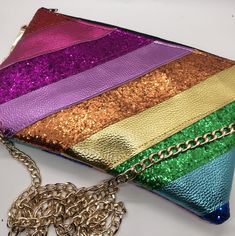 Rainbow metallic stripe faux leather and glitter bag.  Made to order for you. Choose the size and style that you would like. 💛 Made from stripes of different colours of metallic faux leather fabric and glitter fabric. The front and back of the bag are in the same colours and pattern.  💖 Choose the size of bag that you would like from the drop down list. Please scroll along the photos for a little size guide to give you a better idea of the sizes. The size options are: Extra small will be appro Rainbow Rectangular Bag For Parties, Rainbow Rectangular Party Bag, Metallic Rainbow, Glitter Bag, Rainbow Bag, Fringe Bags, Metallic Bag, Rainbow Glitter, Faux Leather Fabric