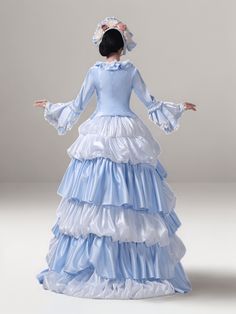 Discover the quintessence of regal fashion with our Blue Elegance Rococo Ball Gown. This resplendent Victorian-style dress cascades in layers of sumptuous fabric, creating a silhouette that celebrates plus-size beauty with sophistication and grace. The soft hue of blue is reminiscent of a serene sky, elegantly contrasted with pristine white lace accents that whisper tales of old-world charm. Each detail, from the delicate lace to the structured bodice, is a tribute to the intricate artistry of t Elegant Blue Victorian Dress For Fancy Dress, Blue Rococo Style Costume Dress, Blue Rococo Costume Dress, Ball Gown Dress With Ruffles For Costume, Blue Rococo Dresses For Costume Party, Fitted Floor-length Marie Antoinette Style Dress, Blue Floor-length Dress For Fancy Dress, Blue Floor-length Fancy Dress, Elegant Blue Victorian Dress For Evening