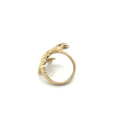 Slither is Designed and handcrafted by Heirloom Pavé. This Serpent ring is crafted in 14k yellow gold. The eyes hold approx. .03ct Red Rubies. This Snake sleekly wraps around the whole finger and continues the designed texture all the way around. It is a nice and weighty ring, at 7.27 grams of 14K yellow gold. The long shape really elongated the fingers. Size 7. This ring has been inspected for authenticity by a Certified Gemologist & Master Jeweler. FOLLOW US TO SEE MORE PHOTOS OF OUR JEWELRY O Yellow Gold Snake-shaped 14k Gold Rings, Unique Yellow Gold Snake Ring, Unique Yellow Gold Snake-shaped Ring, Adjustable Yellow Gold Snake Ring, Adjustable Unique Yellow Gold Snake Ring, Serpent Jewelry, Serpent Ring, The Serpent, Snake Eyes