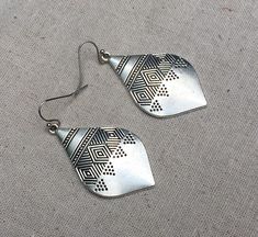 "These are simply stunning! My new personal favorite go to earrings! They have incredible detail and design. Versatile and perfect for everyday wear. Add instant style to any outfit with these beauties! The earrings measure 1 3/4\" long by 1\" wide. They hang from simple silver ear wire hooks. Overall drop length is 1 7/8\". Made from allergy free plated silver. I have a matching necklace in my shop if you would like the whole set. Here is a direct link https://etsy.me/3hNigJ4 Thanks for stoppin Bohemian Hypoallergenic Teardrop Earrings, Festival Teardrop Earrings, Bohemian Adjustable Hypoallergenic Teardrop Earrings, Big Silver Earrings, Aztec Earrings, Drop Earrings Silver, Bohemian Earrings, Big Earrings, Allergy Free