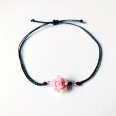 This rosette wax cord bracelet is the perfect gift for the floral lover in your life. Simple and cute rose jewelry goes with every outfit!  Choose between 8 different roses, and over 50 different thread colors! Completely waterproof, adjustable so it will fit any size wrist. Just pull to close. All of my friendship bracelets are made with 100% cotton embroidery floss & my water proof jewelry is made with 100% waxed polyester cord. Any other supplies I use are all natural & eco friendly & everyth Different Roses, Wax Cord Bracelet, Rose Bracelet, Cute Rose, Rose Jewelry, Keepsake Jewelry, Cord Bracelets, Braided Bracelets, Rose Color