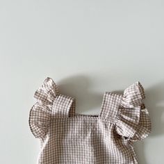 Get ready for summer adventures with our Fly Sleeve Plaid Top & Shorts Set. 🌞 This stylish and casual set is perfect for your little girl's sunny escapades. The sleeveless design keeps her cool, while the square collar adds a touch of elegance. Made from comfortable cotton, this set ensures a perfect fit. The plaid pattern adds a trendy twist, making it a must-have for fashion-forward kids. Are you ready to make a statement? Dress her in this Fly Sleeve Plaid Top & Shorts Set and let her shine! Sleeveless Ruffled Beach Set, Playful Sleeveless Sets For Beach Season, Summer Sleeveless Playwear Sets, Summer Sets With Ruffles And Sleeveless Design, Cotton Tops For Beach Season Playwear, Cute Sleeveless Sets For Vacation, Summer Ruffle Tops For Playwear, Summer Ruffled Tops For Playwear, Summer Sleeveless Cotton Sets