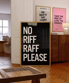 there is a sign that says no riff raff please on the floor next to a table