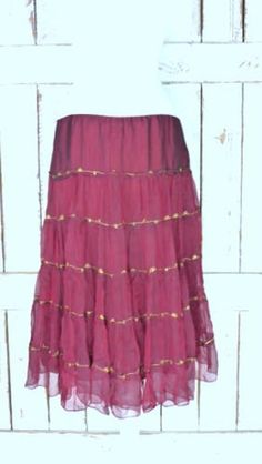 "Vintage sheer silk dark red ruffle midi skirt/mid length tiered festival skirt/90s burgundy/maroon silk skirt/large Features... -sheer 100% overlay -accented with metallic gold threading -stretch poly lining -midi length -zipper side -90's vintage Measurements...taken flat -marked size: large -across waist: 18\" -length: 29\" Condition... -excellent vintage condition -minimal wear UJ2065" Bohemian Fitted Midi Dress, Fall Tiered Ruffled Skirt, Bohemian Fall Party Skirt, Red Tiered Skirt For Summer, Fitted Ruffled Maxi Skirt For Festival, Fitted Maxi Skirt With Ruffles For Festival, Fitted Tiered Maxi Skirt For Festival, Elegant Tiered Summer Skirt, Fitted Tiered Dress With Lined Skirt