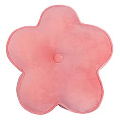 a pink flower shaped pillow on a white background