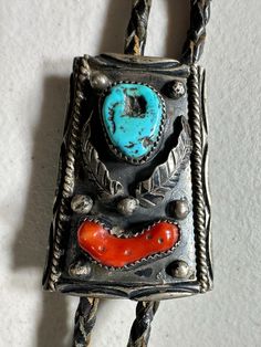 Vintage Viola Calavaza Sterling Silver Turquoise Bolo Tie in a Navajo Design. The sterling silver centerpiece measures approximately 3" x 2". Vintage from the 1960s. Vintage Blue Turquoise Necklace With Concho, Vintage Turquoise Necklace With Concho Detail, Traditional Silver Turquoise Concho Necklace, Traditional Silver Turquoise Necklace With Concho, Traditional Turquoise Concho Necklace, Traditional Turquoise Necklace With Concho, Turquoise Bolo Tie, Silver Centerpiece, Bolo Ties