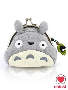 a small purse with a totoro face on it