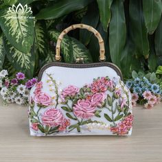 Hello! Welcome to my store! Wish you have a satisfying purchase！ When you have to think of a beautiful, meaningful, impressive gift for your lover, mother or friends then this will be the perfect choice for you! ⭐Don't hesitate to contact us if you have any questions! Thank you ⭐This bag style is a hand bag without a strap. If you want to buy more straps, please buy them here: https://www.etsy.com/listing/1460719306/metal-shoulder-handbag-strap-metal?ref=listings_manager_grid *Embroidered handbag ⭐The bag is handmade, each stage is carefully cared for by skilled craftsmen. ⭐The bag is embroidered with very prominent, strange and beautiful ribbons. ⭐The bag is made of velvet fabric +The inner lining of the  bag is made of various fabrics +Internal zipper pockets +Internal pocket *Approximat Rose Handbag, Embroidery Ribbon, Purse Ideas, Embroidered Handbag, Handbag Strap, Crystal Bags, Embroidery Bags, Baby Fairy, Wedding Purse