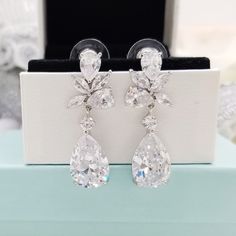 "⚠️⚠️⚠️ PLEASE MAKE SURE TO SEE THE PHOTO TO CHOOSE WHICH MESSAGE CARD NUMBER (#1-30) YOU WOULD LIKE ⚠️⚠️⚠️ SPECIFICATIONS: ♠ For Earrings * Metal Type : Rhodium plated * Material : Cubic Zirconia *Earrings Length : 1 5/16\" (3.4 cm) ♠ Message gift box * There is a white lining cushion behind the message card for added protection of the jewelry. * Box Size :2\" x 3\" * Box color : White, Kraft, Oatmeal, Jade Matte, Blue Ice Gloss, Forest Matte, Red Matte, Orchid Matte, Purple Matte, Navy Matte, Pear-shaped Cubic Zirconia Bridal Earrings As Gift, Hypoallergenic Dangle Diamond Earrings For Wedding, Hypoallergenic Silver Diamond Earrings For Wedding, Silver Hypoallergenic Teardrop Earrings For Wedding, Hypoallergenic Cubic Zirconia Bridal Earrings For Wedding, Hypoallergenic Cubic Zirconia Wedding Crystal Earrings, Elegant Hypoallergenic Cluster Earrings For Wedding, Hypoallergenic Cubic Zirconia Bridal Earrings, Hypoallergenic Cubic Zirconia Wedding Earrings