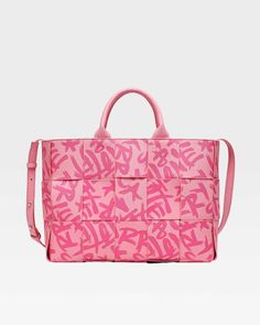 Make a bold statement with the Pink Graffiti Tote Bag, a playful and eye-catching accessory that's perfect for adding a pop of color to any outfit. This stylish tote features a vibrant pink color and a striking graffiti print, adding a touch of urban edge to any ensemble. The woven construction and double handles provide both style and functionality, while the spacious interior offers plenty of room for your essentials. Luxury Pink Tote Baguette Bag, Luxury Pink Bucket Tote Bag, Luxury Pink Tote Flap Bag, Pink Wallpaper Shopping Bag, Pink Square Tote Bag, Luxury Pink Tote Box Bag, Cheap Pink Bags With Letter Print, Luxury Pink Canvas Shoulder Bag, Hot Pink Shopping Bags