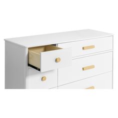 a white dresser with gold handles and drawers