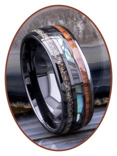 an image of a wedding ring with wood and abamole inlays on it