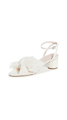 a women's white sandal with bow detail