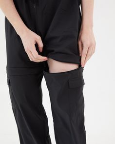 It doesn't get more functional than the Double Take Utility Pant. One minute they're the chicest, most comfortable activewear pant of your dreams, and the next they're your favorite high waisted active shorts. The pants feature two cargo pockets, hidden zippers for a seamless transition into shorts, and adjustable ankles to make it as easy as possible to slip the bottom half off over your sneakers. Running from afternoon workout to a fun happy hour with friends? Ditch the sneakers, cinch the adj Utility Pants With Built-in Shorts For Outdoor Activities, Functional Travel Bottoms With Cargo Pockets, Sporty Cargo Pants With Built-in Shorts For Outdoor Activities, Black Bottoms With Pockets For Travel, Athleisure Bottoms With Cargo Pockets For Outdoor, Sporty Travel Bottoms With Cargo Pockets, Sporty Outdoor Pants With Built-in Shorts, Afternoon Workout, Sneakers Running