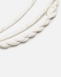 three white braided rope on a white background