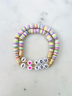 Bracelet set $20 Mommy And Me Jewelry, Pastel Bracelets With Colorful Beads For Gift, Pastel Colorful Beads Bracelets As Gift, Pastel Colorful Beads Bracelet As Gift, Playful Gold Friendship Bracelets As Gift, Pastel Letter Beads Bracelet For Gift, Pastel Letter Beads Bracelet As Gift, Heishi Beads Name Bracelet As Gift, Rainbow Heishi Beads Bracelets As Gift