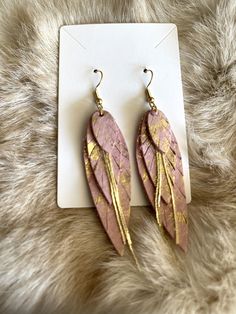 Indulge in the soft elegance of our Feathered Pink Genuine Leather Layered Earrings, meticulously handcrafted to elevate your style. These stunning earrings feature delicate layers of genuine pink leather, exuding a subtle yet captivating charm that effortlessly complements any look. The hypoallergenic hardware ensures a comfortable fit for even the most sensitive ears, allowing you to enjoy these statement earrings without any worries. Whether it's a casual outing or a special occasion, these e Layered Earrings, Payson Az, Diy Earrings Easy, Inspired Jewelry, Stunning Earrings, Feather Earrings, Sensitive Ears, Leather Earrings, Diy Earrings