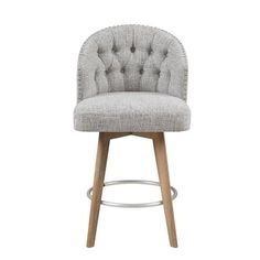 an upholstered grey bar stool with wooden legs and buttoned backrests