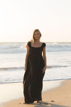 The Florence Linen Black Maxi Dress boasts a flowy fit and elegant cap sleeves. Crafted from 100% linen, this dress is perfect for any occasion, providing both comfort and sophistication. Black Dress Beach Photoshoot, Dress Beach Photoshoot, Black Dress Beach, Mini Jumpsuit, Dress Beach, Strapless Tops, Beach Photoshoot, Sleeve Maxi Dress, Black Maxi