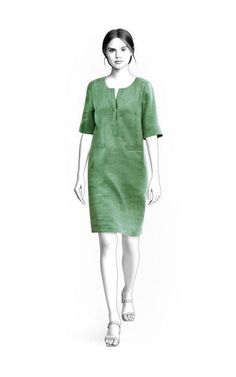 a woman in a green dress is standing