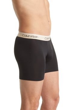 A stylish logo waistband brands sleek boxer briefs cut from a silky, ultra-comfortable microfiber fabric. Pack of three pairs No fly 88% polyester, 12% elastane Machine wash, tumble dry Imported Men's Clothing Stylish Logo, Black Olive, Boxer Briefs, Briefs, Low Rise, Men's Clothing, Calvin Klein, Sleek, Nordstrom