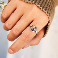 This personalized Flower Heart Ring is a perfect gift for mom, grandma, family, friend, or just anyone who wants a reminder of their loved ones! It's fun to choose the colored stones to represent all of the ones you care about. Multicolor Heart Ring For Valentine's Day, Personalized Silver Heart Cut Birthstone Ring, Multicolor Heart-shaped Ring For Gift, Heart Shaped Sterling Silver Birthstone Ring For Birthday, Valentine's Day Heart-shaped Birthstone Ring, Sterling Silver Heart-shaped Birthstone Ring For Birthday, Heart-shaped Gemstone Rings For Mother's Day, Heart Shaped Gemstone Rings For Mother's Day, Personalized Heart Birthstone Ring In Sterling Silver