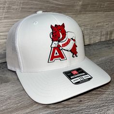 Our Pvc Patch Is A Waterproof, Rugged, And Clean Looking Design. You Can Bet That This Patch Will Look Vibrant For Years To Come. We Only Use The Highest Quality Products And Headwear. We Believe That Our Pvc Patches Beat Out Any Other Type Of Patch Offered On A Hat. Design: Arkansas Razorbacks- Leaning A Hat: Richardson 112 Color: White Structured, Six-Panel, Mid-Profile 60/40 Cotton/Polyester Adjustable Plastic Snapback Pre-Curved Contrast Stitched Visor Hat Size: 7 - 7 3/4 White Snapback Hat For Fan Gear, White Collegiate Snapback Hat, White Snapback Fitted Hat For Game Day, White Casual Baseball Cap For Fans, White Flat Brim Baseball Cap For Game Day, White Collegiate Cap, White Flat Bill Hats For Game Day, Casual White Baseball Cap For Fans, White Casual Game Day Fitted Hat