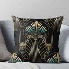 a black and gold art deco design throw pillow