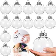 a hand holding a glass ball ornament in front of a group of christmas ornaments