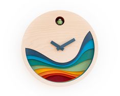 a wooden clock with colorful waves on it