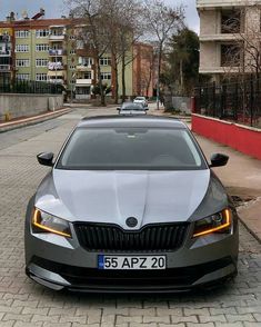 a silver car parked on the side of a road