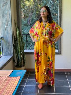 I made this Kaftan from a beautiful floral pattern in satin silk fabric. It is very soft with a nice flowy feel to it making you feel as if you are not wearing anything. It is so free flowing, that it will make you feel as if you aren't wearing anything at all ;) The beauty of the Kaftans is they will fit everyone so no need to worry about the size et all. All my Kaftans have deep necks(11-12 inches) so will fit all head sizes. However, the length of my kaftans will vary. I make all my kaftan st Traditional Floral Print Kimono For Summer, Traditional Floral Print Summer Kimono, Beach Festival Kimono With Kimono Sleeves, Traditional Summer Kimono With Floral Print, Festive Beach Kaftan With Kimono Sleeves, Long Beach Robe With Floral Print, Long Floral Print Robe For Vacation, Long Summer Kimono For Festive Occasions, Festive Vacation Kaftan With Kimono Sleeves