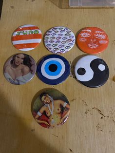 there are six buttons with pictures on them