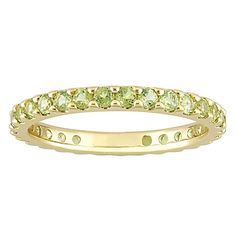 Featuring a stunning series of peridot stones, this 10k gold eternity ring is a perfect piece to add to your fine jewelry collection. Featuring a stunning series of peridot stones, this 10k gold eternity ring is a perfect piece to add to your fine jewelry collection. Width: 2.4 mm Metal: 10k gold Finish: polished Packaging: boxedSTONE DETAILS Stone type: peridot Total weight: 1 1/5 ct. Shape: round Setting: buttercup Gemstones may have been treated to enhance their appearance. Special care may b Classic Green Stackable Eternity Band, Yellow Gold Peridot Stackable Rings, Classic Green Gemstone Eternity Band, Gold Eternity Ring, Eternity Ring Gold, Peridot Stone, Right Hand Rings, Fine Jewelry Collection, Eternity Bands