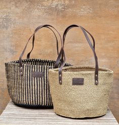 Add a touch of timeless style with this handcrafted tote bag, woven by our self-help group of women weavers in a rural Kenyan village. Made from 100% natural sisal fiber, a resilient perennial succulent, and finished with durable genuine leather, this tote is perfect for daily errands, beach outings, or casual wear. Each unique bag carries a story of passion and love in every strand, supporting the livelihoods of its makers and preserving an ancient craft tradition. Sustainable and eco-friendly, Shopping Basket Bag Made Of Natural Fiber, Natural Fiber Shoulder Bag With Rolled Handles For Everyday, Everyday Use Shoulder Bag With Rolled Handles, Eco-friendly Basket Bucket Bag With Leather Handles, Eco-friendly Basket-shape Bucket Bag With Leather Handles, Eco-friendly Straw Bag With Rolled Handles, Natural Jute Bags With Rolled Handles, Natural Crochet Bag With Rolled Handles For Shopping, Natural Crochet Jute Bag With Rolled Handles