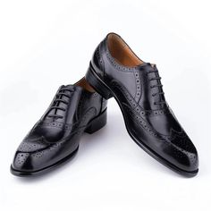 Step into sophistication with our elegant carved British leather Wedding shoes. Crafted from the finest first layer cowskin, these shoes feature a solid pattern and a round toe shape for a timeless and polished look. With a genuine leather lining and a rubber outsole for added comfort and durability, these lace-up shoes are perfect for any business occasion. Elevate your style and make a lasting impression with our exquisite leather business shoes. Wedding Lace-up Shoes With Brogue Detailing, Classic Closed Toe Lace-up Wedding Shoes, Black Wingtip Dress Shoes For Wedding, Black Oxfords For Wedding With Round Toe, Black Oxfords With Round Toe For Wedding, Black Round Toe Oxfords For Wedding, Black Round Toe Leather Wedding Shoes, Black Closed Toe Oxfords For Wedding, Black Round Toe Leather Shoes For Wedding