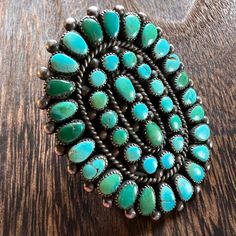 --MEASUREMENTS--   Size: 7 Height: 2 1/4" Width: 1 3/4" Stone: natural turquoise Weight: 24g 1930's natural turquoise and silver ring.  We do not polish, scratch or acid test antique silver. We can guarantee that each piece is coin silver or better. All pieces are in "as found" condition when we list them.  In addition, we rarely include our guess on what mine a stone is from. It would be just that, an educated guess. Each item over $100 will be insured when shipped. Once the package is in the possession of the post office, shipping speed is out of our hands. I do pay attention to each order, and will keep you updated if I notice any delays in shipping.  Photographed in a mix of natural and artificial light. 0C0616 The Possession, Metalwork Jewelry, Artificial Light, Vintage Turquoise, Ethnic Jewelry, Natural Turquoise, Native American Jewelry, Cluster Ring, Post Office