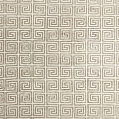 an area rug with white and brown squares on it