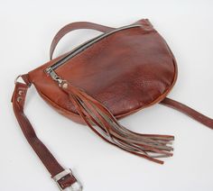 "Large Cognac Brown Belt Bag For Women, Waist Pack, Leather Woman Bag, Leather Belt Bag,Fanny Pack, Leather Pouch, Hip Bag Leather * More colors- large fanny pack: https://www.etsy.com/shop/LabelTreasures?ref=seller-platform-mcnav&section_id=24012078 ← Back to the shop: https://www.etsy.com/shop/LabelTreasures Leather fanny pack: * Highest quality Italian leather * Unlined * Inside slip pocket * One main compartment with a zipper * Metal silver hardware Dimensions: Height: 19 cm (7,5 in) Max Brown Belt Bag With Removable Belt For Daily Use, Brown Pouch Shoulder Bag With Removable Belt, Brown Bags With Belt For Everyday Use, Brown Belt Bag With Zipper Pocket, Brown Shoulder Bag With Removable Belt, Brown Pouch Belt Bag With Removable Belt, Brown Pouch Bag With Removable Belt, Brown Pouch Belt Bag, Brown Belt Bag With Removable Belt