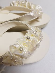 Wedding at the beach Sandals, or Destination Weddings! US Sizes: whole sizes only 5, 6, 7, 8, 9, 10, 11 HIGHT: 2 1/2'' Inches. SIZE: 7 READY TO SHIP. I designed these gorgeous design with unique materials I found in my inventory (yes, I buy when I travel, unfortunately I got all they had:) I have enough material to make 3 more pairs; contact soon. Colors: Ivory only, Pictures may be misleading because of the different lighting on each screen, this sandals are the creamy standard ivory, you may c Elegant Adjustable Sandals For Bridal Shower, Elegant Adjustable White Wedding Shoes, Elegant White Adjustable Wedding Shoes, Elegant Adjustable Flip Flops For Beach, Elegant Adjustable Wedding Shoes For Beach Wedding, Elegant Wedding Toe Post Sandals, Elegant White Wedding Shoes For Beach Ceremony, Elegant Adjustable Sandals For Beach Wedding, Adjustable White Sandals For Beach Wedding