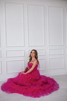 This hot pink princess dress will make you feel like you stepped straight out of a fairy tale. With its floor length and voluminous design,  it's perfect for any romantic occasion, from weddings to proms.  The small velvet belt and bow ties add unique and beautiful touches,  making you look and feel majestic.  (No awkward pumpkin coach rides here.) Message me for any kind of customizations. Pink Princess Tulle Evening Dress, Floor-length Princess Dress For Prom, Floor-length Princess Prom Dress, Princess Tulle Quinceanera Dress For Gala, Pink Gown With Sweetheart Neckline For Prom, Pink Floor-length Ball Gown For Prom Season, Pink Princess Evening Dress, Pink Princess Gown For Debutante Ball, Princess Style Ball Gown Tutu Dress For Prom