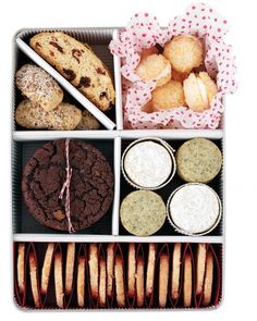 an assortment of pastries and cookies in a tray