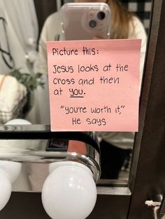 a note attached to a mirror that says picture this jesus looks at the cross and then at you