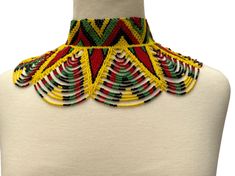 Add a touch of culture and beauty to your outfit with this authentic African ethnic collar choker necklace. The necklace features a stunning array of multicoloured beads that are handcrafted to perfection, giving it a unique and eye-catching appeal. Its beaded design consists of a combination of choker and collar styles that sit comfortably around your neck to complement any attire. This necklace is perfect for anyone who loves to explore different cultures and appreciates handmade jewelry. It i Large Beads Festival Choker, Traditional Tiny Beads Choker Necklace, Festival Large Beads Choker, Traditional Multicolor Beaded Bracelets, Traditional Colorful Bead Choker, Traditional Multicolor Beaded Bracelets With Large Beads, Traditional Large Beads Choker Necklace, Traditional Large Beaded Choker Necklace, Festival Choker With Large Beads