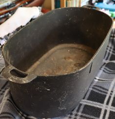 an old frying pan sitting on top of a table