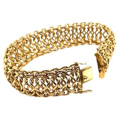 This stunning Italian gold bracelet has the look and feel of pure luxury! Beautifully interwoven links of high-polished 18k yellow gold create wonderful visual and actual movement, in an ultra-comfortable design that makes this bracelet a pleasure to wear! It is a gorgeous piece with substantial weight that will make you feel both elegant and confident every time you put it on! With the ability to transition effortlessly between everyday wear and special occasions, this is a beautiful signature Luxury Adjustable Yellow Gold Bracelet, Luxury Yellow Gold Rondelle Bracelet, Luxury Yellow Gold Rectangular Bracelets, Luxury Ornate Gold Bangle Bracelet, Luxury Fusion Style Yellow Gold Jewelry, Luxury Yellow Gold Sterling Silver Classic Bracelet, Luxury Rectangular Gold-tone Jewelry, Luxury Yellow Gold Ornate Bracelet, Luxury Yellow Gold Bracelet With Clasp