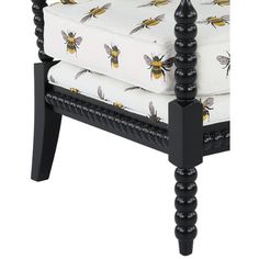 a black and white chair with bees on it