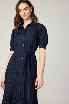 Framed by puffed sleeves, this midi dress has a pointed collar and a button-up half placket that lets you control the coverage. It's got crisp pleats that flow to a mid-length skirt with embroidered eyelets and a scalloped hem. Wear it cinched by the matching tie belt to highlight your waist. •Pointed collar •Button front placket •Short puff sleeves •Partially smocked cuffs •Optional tie belt •Pleated skirt •Scalloped mid-length hemDIMENSIONS •Standard: 48" Length Item number 2490204 65% POLYEST Eyelet Midi Dress, Mid Length Skirts, Print Trends, Eyelet Dress, Vacation Dresses, Sweater Sale, Puffed Sleeves, Scalloped Hem, Trending Dresses